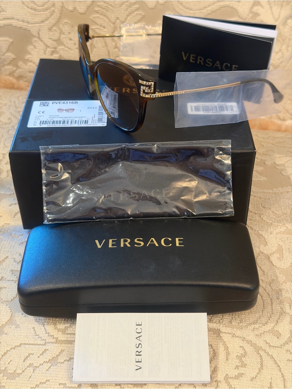 Versace VE4316-B oversized cat-eye crystal accents.